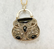 STERLING SILVER, ONYX AND MARCASITE PENDANT