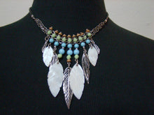 Leaf and bead portion measure 3" in length